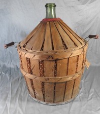 Ancienne bonbonne Dame Jeanne  de pharmacie recouverte de bois hauteur 40 cm