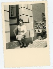 1956 Snapshot PHOTO, a woman sitting on a front door shadow plants