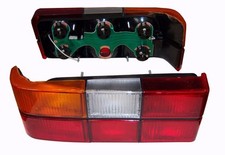 Volvo 240 244 tail light complete left side w/ black molding MADE IN EU1372449