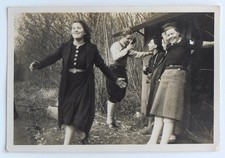 Young adults having fun forest movement - old photo snapshot