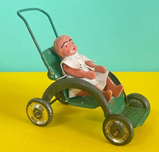 ANTIQUE MINIATURE DOLL IN IRON STROLLER - RARE PENNY TOY - TIN TOY
