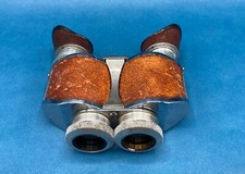 French leather-clad binoculars, with interlocking lenses. Antique.