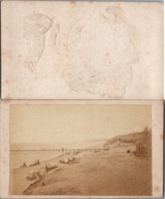 Sandy beach and pier wooden pontoon to identify, cabins on wheels, circus