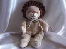 Doudou lion beige en tricot 