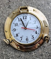 Horloge murale hublots en