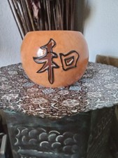 Photophore orange avec petite bougie, style Asie