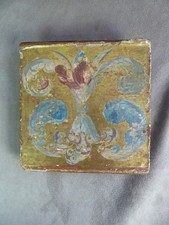 SMALL PANEL in gilded and painted wood, 18th century.
