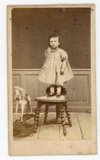 CDV PHOTO, child in straight dress on a wooden horse chair roulette mane