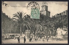 Old postcard Ollioules, Avenue de la gare animated with clock and palm trees 