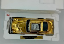 GOLD  DANBURY MINT 1/24 ASTON