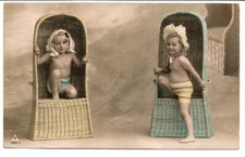 Young children and wicker armchairs. written in 1909.