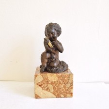 Charming 1900s "Child with the Tambourine" sculpture on marble base.