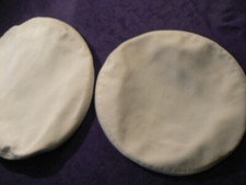 TWO WHITE BERET COVERS