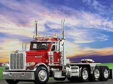 1/64 DCP RED PRIDE & CLASS PETERBILT 389 HEAVY HAUL TRI AXLE DAY CAB