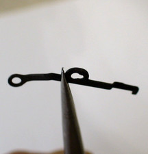 Briquet [ Ressort plat pour