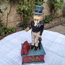 TIRELIRE AUTOMATE EN FONTE