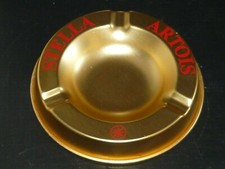 old gold metal ashtray beer Stella Artois bistro vintage 
