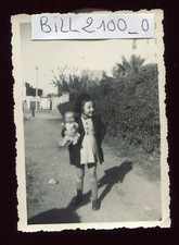 old photo. girl with her celluloid baby 