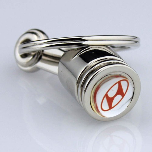 Magnifique porte clés piston - magnifique,