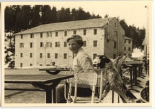 Woman sitting chair terrace coffee dog - old amateur photo year. 1940 50
