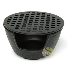 Chauffe théière en fonte