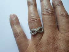 bague en argent massif, signe