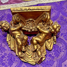 small wall console decorated with angels angels cherubim in gold stucco epok 1980