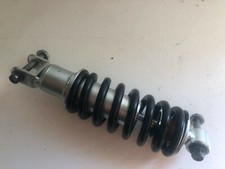 UN AMORTISSEUR ARRIERE MOTO