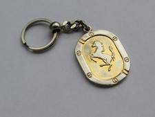 Old Ferrari car key fob in metal - garage Zenith S.A Lausanne Switzerland