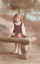 CP LITTLE GIRL BEHIND BENCH WITH ROSES