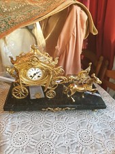 Bronze clock on marble horses