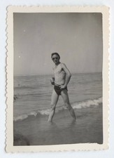 Young man poses beach swimsuit swimsuit glasses - old photo snapshot