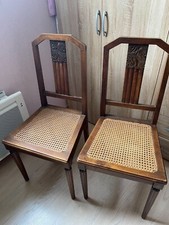 Vend 2 chaises cannées en bois brun vintage