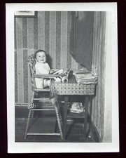 old photo child in his high chair. life scene