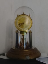 PENDULE 400jours  ronde en laiton doré, A Reviser