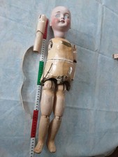 Poupée  tête porcelaine