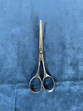 Anciens ciseaux courbes coiffeur 