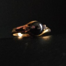 Bague perle noire assortie de