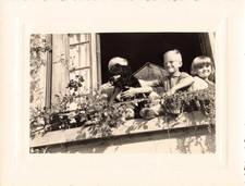OLD PHOTOGRAPH GROUPS OF YOUNG CHILDREN AND THEIR DOG AT THE WINDOW