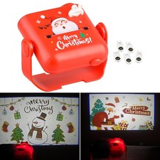 Le projecteur de noël allume les lumières d'ambiance de noël pour le mur