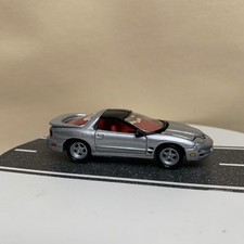 Johnny Lightning 2001 Pontiac Firebird Trans Am WS6 Silver/Red Interior 1:64 NM