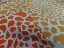 Tissu lycra double face imprimé girafe ton orange et blanc