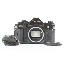 Canon A-1 + très bien