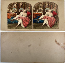 Woman in an armchair pulling up her stockings, vintage albumen print, ca.1860, stereo