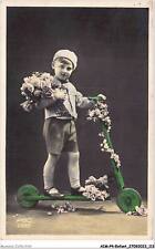 AIMP4-0370 - CHILD - a child on a scooter with a bouquet of flowers