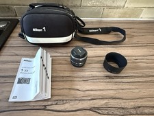 Pochette + objectif Nikon 1