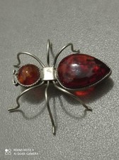 Broche araignée en ambre –
