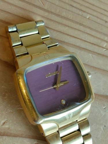 Nixon the player - gold, purple