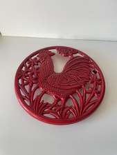 dessous de plat en fonte rouge