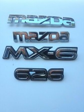 Lot d'emblèmes (4) Mazda